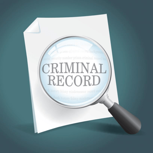 Magnifying glass highlighting the text "CRIMINAL RECORD" on a document, symbolizing legal topics related to criminal defense and background checks.