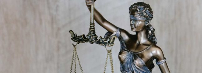 Bronze statue of Lady Justice holding scales, symbolizing fairness and the legal system, relevant to DUI laws and legal guidance in Virginia.